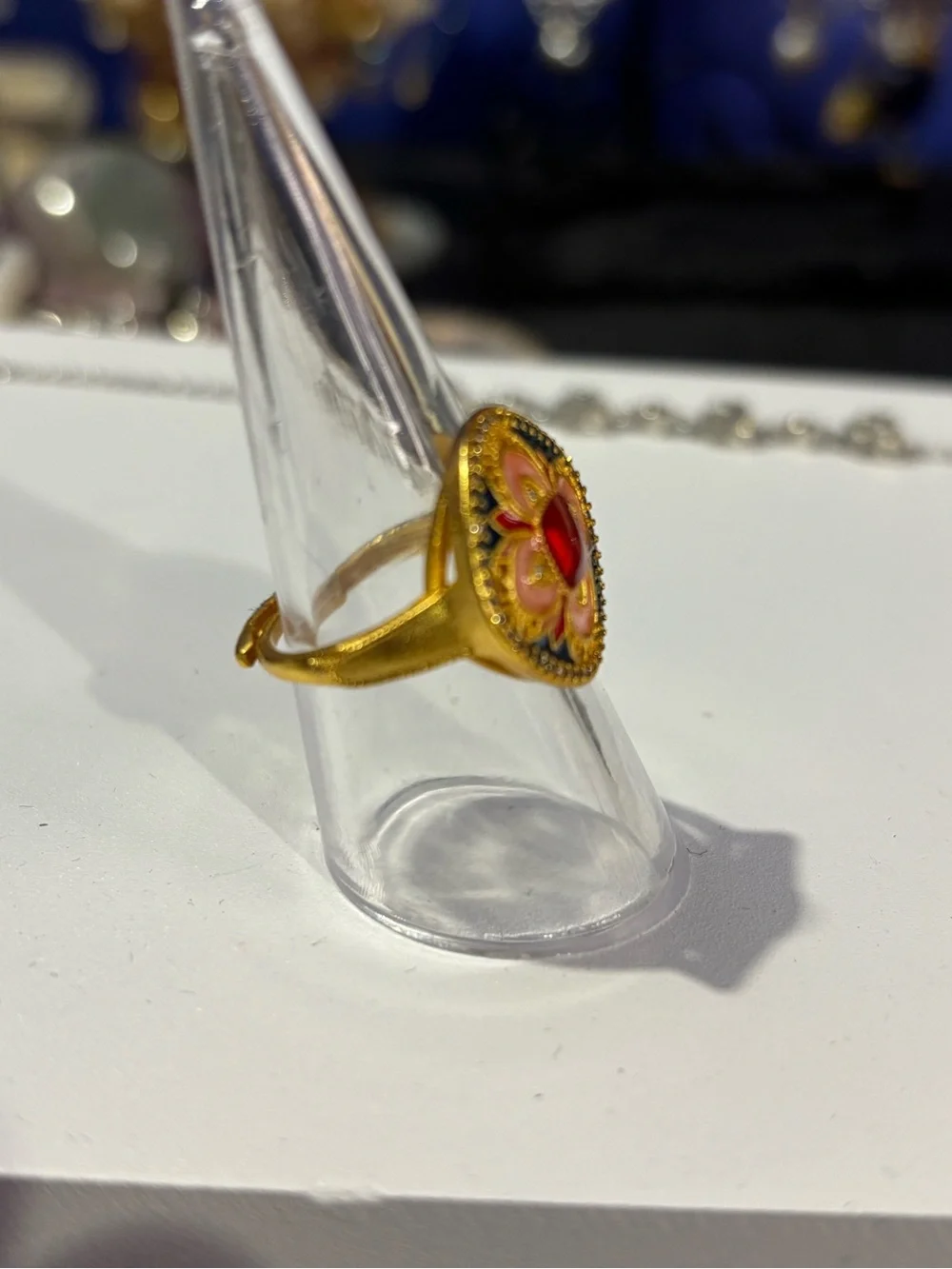 Gold-Plated Floral Ring with Red Center Stone